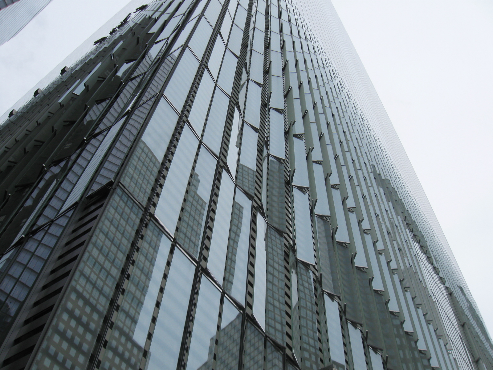 looking up at one world trade center. you can see the intricate glass panels that make up the facade